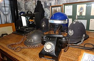 Exhibits at the Coventry Police Museum including the historic charge desk which was used for over 100 years