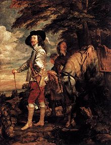 Old portrait of a man standing outdoors with his horse and groom, with red breeches, a white coat, a sword, walking stick and black hat with a large brim.