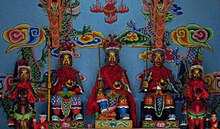 The pan-Chinese Sanxing (Three Star Gods) represented in Bai iconographic style at a Benzhu temple on Jinsuo Island, in Dali, Yunnan. Benzhu Sanxing, Dali, Yunnan.jpg