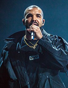 Drake holding a microphone and facing forwards