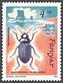 Oktober: Amara aulica (färöisch svartaklukka), ein von den Wikingern auf den Färöern eingeschleppter Käfer. Briefmarke von 1991.