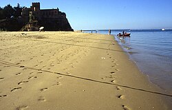 A view of the golden sand of Praia Grande near the Fort of São João do Arade
