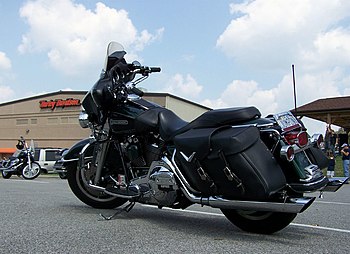 A black Harley-Davidson motorcycle with saddlebags