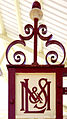 An old London, Midland and Scottish Railway monogram at the station