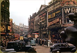 Outdoor advertisements, such as Shaftesbury Avenue, London c. 1949 pictured here, are usually placed in busy locations. London , Piccadilly Circus looking up Shaftsbury Ave , circa 1949 ,Kodachrome by Chalmers Butterfield.jpg