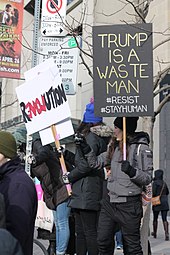 A demonstrator in Toronto holds up an anti-Trump sign in February 2016 MG 7786 (31939663183).jpg