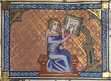 The author of a manuscript at his writing desk. 14th century Roman de la Rose f. 28r (Author at writing desk).jpg