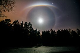 Long exposure of a night-time lunar halo display, including an upper tangent arc, 22° halo, and paraselenic circle