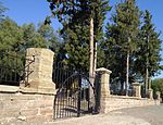 The original portion of this ring-wall dates from 1857 and was erected when the Nederduitse Gereformeerde (NG) Church cemetery was laid out. A joint fund-raising campaign by the NG and the Anglican congregations in 1887 enabled them to extend the ring-wall. Type of site: Graveyard