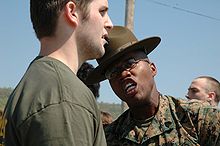 A drill instructor yells at a delayed entry program poolee Marine Corps drill instructor yells at recruit.jpg