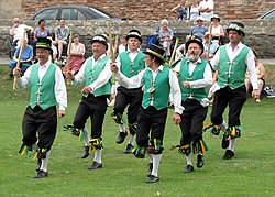 Morris dancing in the grounds of Wells Cathedral, Wells, England