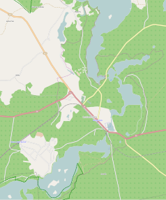 Mapa konturowa Rucianego-Nidy, na dole po lewej znajduje się punkt z opisem „Parafia Trójcy Świętej”