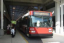 An airport shuttle bus at the station Shuttle bus at BWI Rail Station, June 2007.jpg