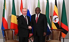 In May 2023, South Africa announced that it would grant diplomatic immunity to Vladimir Putin to attend the 15th BRICS summit despite the ICC's arrest warrant. Vladimir Putin and Cyril Ramaphosa (2023-06-17).jpg