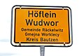 Bilingual road sign for Höflein/Wudwor