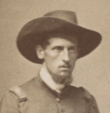 Old picture of a young-looking American Civil War officer wearing hat with mustache and low beard