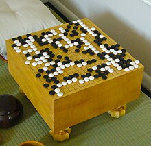 Go is an abstract strategy board game for two players, in which the aim is to surround more territory than the opponent, and which was invented in China more than 2,500 years ago. FloorGoban.JPG