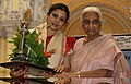 Bhattacharyaa, the Odissi Dancer receiving Raas Ratna Award from Padma Bhusan Girija Devi