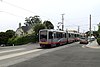 An outbound train at Ulloa Street and Forest Side Avenue, 2017