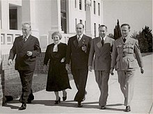 Sir Robert Menzies, Dame Enid Lyons (the first female member of an Australian Cabinet), Sir Eric Harrison, Harold Holt (Menzies' successor) and Tom White, in 1946. Menzies Lyons Harrison Holt AAF.jpg