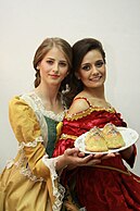 "Breast" Pastry,[18] created by convent, displayed by models in period costume