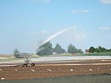 A travelling sprinkler at Millets Farm Centre, Oxfordshire, United Kingdom