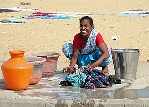 English: Woman doing laundry in Chennai, India...