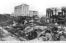 An image with storm debris piled high above ground