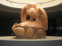 Bill Reid's sculpture The Raven and the First Men, showing Raven releasing humans from a cockle shell. Museum of Anthropology at the University of British Columbia. Bill Reid raven.jpg