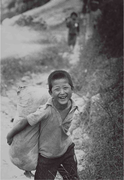 Child smiling on Daemado island, Jindo County. He asks "Are you filming a movie, Mister?" (October 9, 1972)