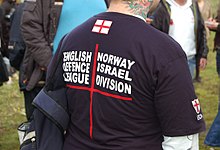 Branded EDL clothing listing the group's links with other organisations abroad English Defence League-2 (30 oktober 2010, Amsterdam).jpg