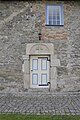 Eingangsportal und Fenster an der Nordseite des Schiffes