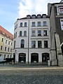 Wohnhaus in geschlossener Bebauung, mit Laden, Eckhaus zum Untermarkt