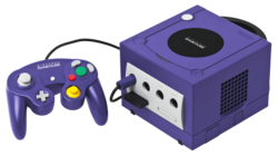 Indigo-colored GameCube with controller and memory card