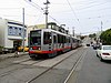 An inbound train at 15th Avenue and Taraval, 2018