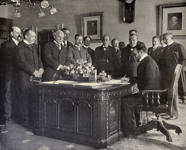John Hay, Secretary of State, signing the memorandum of ratification on behalf of the United States.