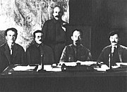 Members of the presidium of CheKa (left to right) Yakov Peters, Józef Unszlicht, Abram Belenky (standing), Felix Dzerzhinsky, Menzhinsky, 1921