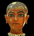 The discovery of the Head of Nefertem is controversial, since Howard Carter did not document the piece in his excavation journal. The Head was found in 1924 by Pierre Lacau and Rex Engelbach in KV4 (the tomb of Ramses XI), which was used as a storehouse for the excavation efforts,[1] among the bottles in a box of red wine.[2] At this time, Carter was not in Egypt on account of the strike and closure of Tutankhamun's tomb and the withdrawal or cancellation of the excavation license of Lord Carnarvon's widow Almina, Lady Carnarvon. Carter later stated that he had found the head among the rubble in the entry corridor of KV62.[3] In his first season of excavations, the head was not mentioned; at the time Carter only noted partially broken and full-standing alabaster vessels and vases of painted clay in the entrance-way. There is not even photographic documentation of the head in the excavation journal as there is for other pieces found in the tomb.[4] These facts not only led to further disputes in the study of Egyptian antiquities, but also aroused the suspicion in some quarters to this day that Carter had attempted to steal the head.[5]