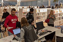 Patrons at Helsinki Central Library 2018 Oodi, Central Library, Helsinki, Finland (45606702064).jpg