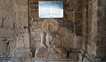 A statue of Buddha (at Jaulian, Taxila) with a hole in the navel is an odd artifact. It is called the "Healing Buddha". Buddhist pilgrims put their fings in the navel hole and pray for the ailment of the patients. A statue of buddha with a hole in the navel.jpg