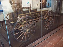 The Dejbjerg wagon, a composite of two identical wagons found at Dejbjerg, now in the National Museum of Denmark, Copenhagen. The remains of six wagons, dating from the first century BCE, were discovered in 1881-1883 in a bog near Dejbjerg, Jutland, together with bronze ornaments and face masks. Dejbjerg wagon, Nationalmuseet Copenhagen.jpg