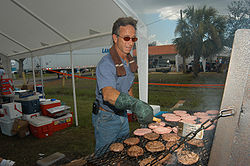Arcadia, FL, August 29, 2004 - A Catholic Relief Charities volunteer cooks burgers for residents affected by Hurricane Charlie FEMA - 10370 - Photograph by Mark Wolfe taken on 08-29-2004 in Florida.jpg