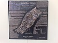 Relief plaque of Papua New Guinea outlining the Kokoda Track campaign