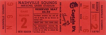 A red rectangular ticket with game and seating information