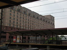 Southbound platform of New Brunswick's NJ Transit train station. University Center at Easton Avenue is in the background. NewBrunswickStationNJ.JPG