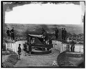 Officers of Companies A and B 3d Massachusetts Heavy Artillery and crew of 100-pdr Parrott gun on iron barbette carriage at Fort Totten