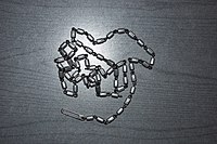 A cleaning cord with a clip at the end for attaching a patch.