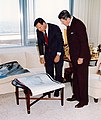 Christopher Cox shows President Ronald Reagan the blueprints for the new Federal Courthouse in 1993