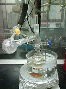 Dimethyl sulfoxide usually boils at 189 degC. Under a vacuum, it distills off into the receiver at only 70 degC. Vacuum distillation of DMSO at 70C.jpg