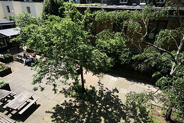 Connaught Hall's private courtyard garden, with the bar terrace at the top of the picture Connaught Hall courtyard.jpg